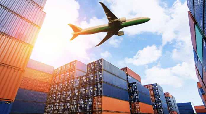 Cargo containers and aircraft at port symbolizing expanded U.S. dairy export trade under new agreements with Argentina, El Salvador and Guatemala